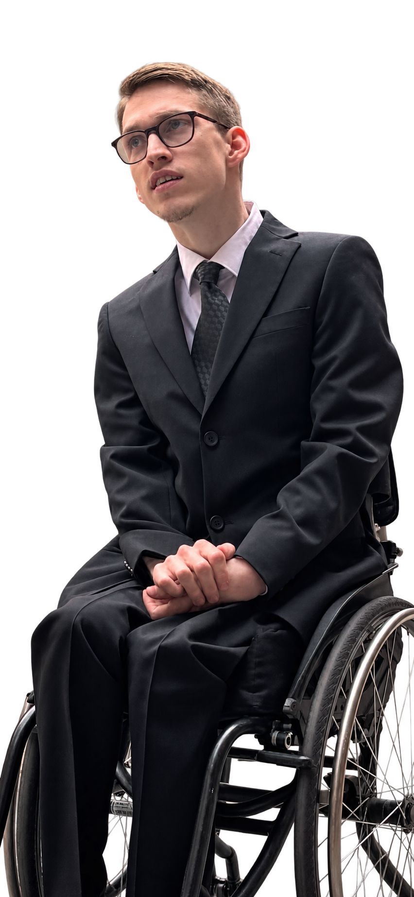 Sebastian Hällman wearing a suit, seated in his wheelchair